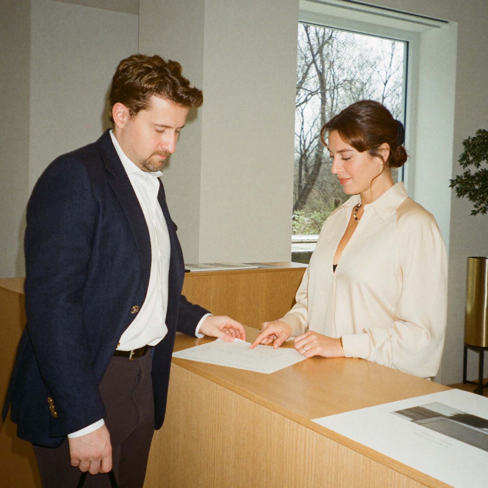 Two colleagues reviewing a financial report