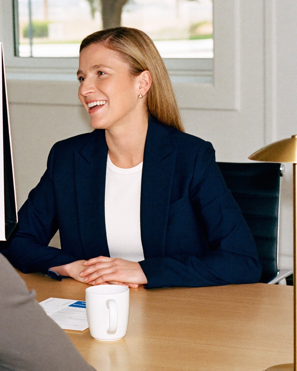A payroll specialist at her desk